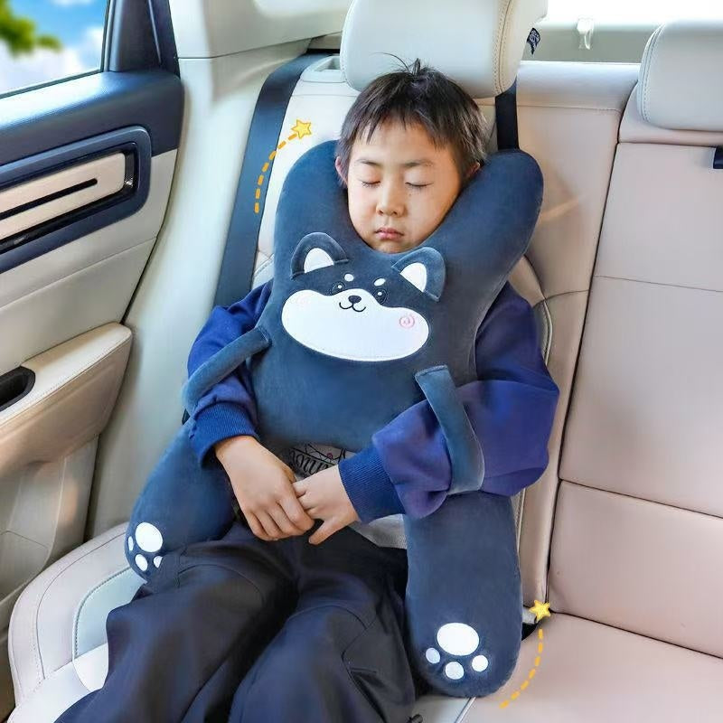 Child asleep in the car with the Gray Husky road trip pillow strapped to the headrest