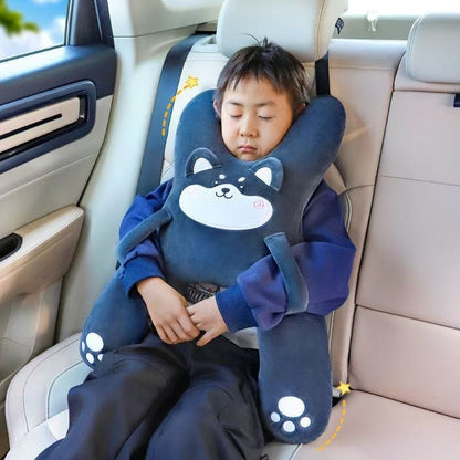 Child asleep in the car with the Gray Husky road trip pillow strapped to the headrest