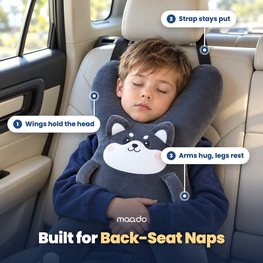 Built for back-seat naps: wings hold the head, strap stays put on the headrest, arms hug and legs rest