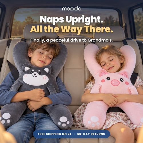 Two kids napping upright in the back seat with Maado Road Trip Pillows on a sunset road trip